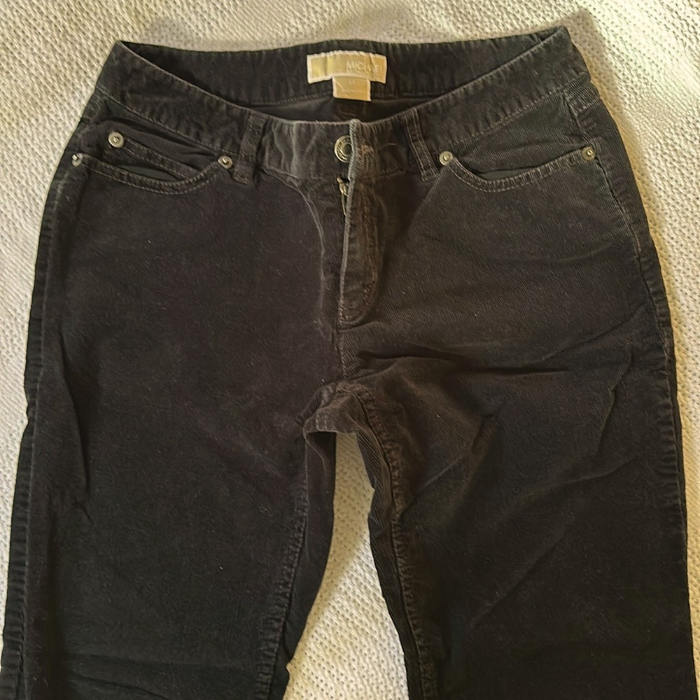 Ladies Michael Kors black fine corduroy straight leg pants.